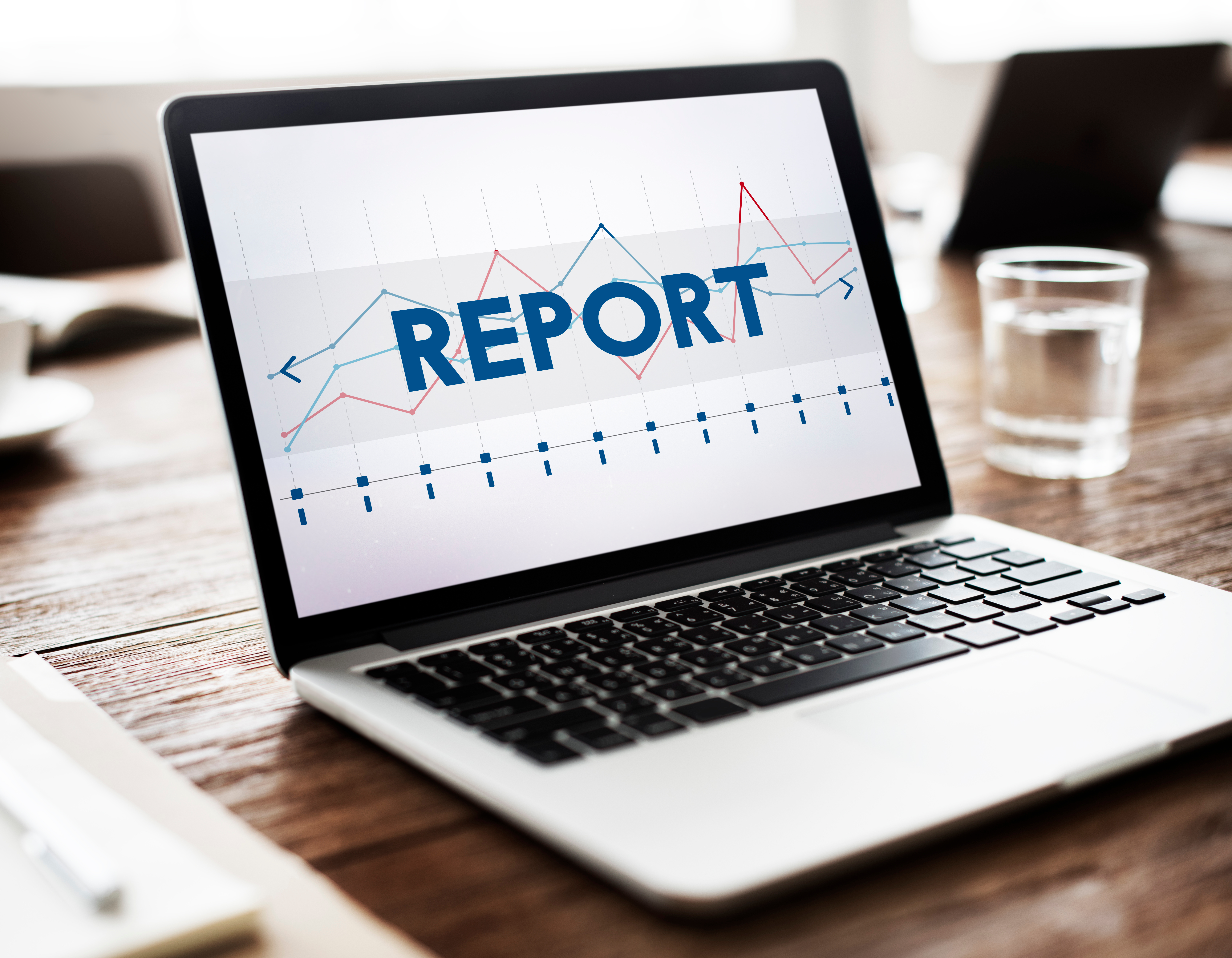 Laptop displaying a report with trend lines