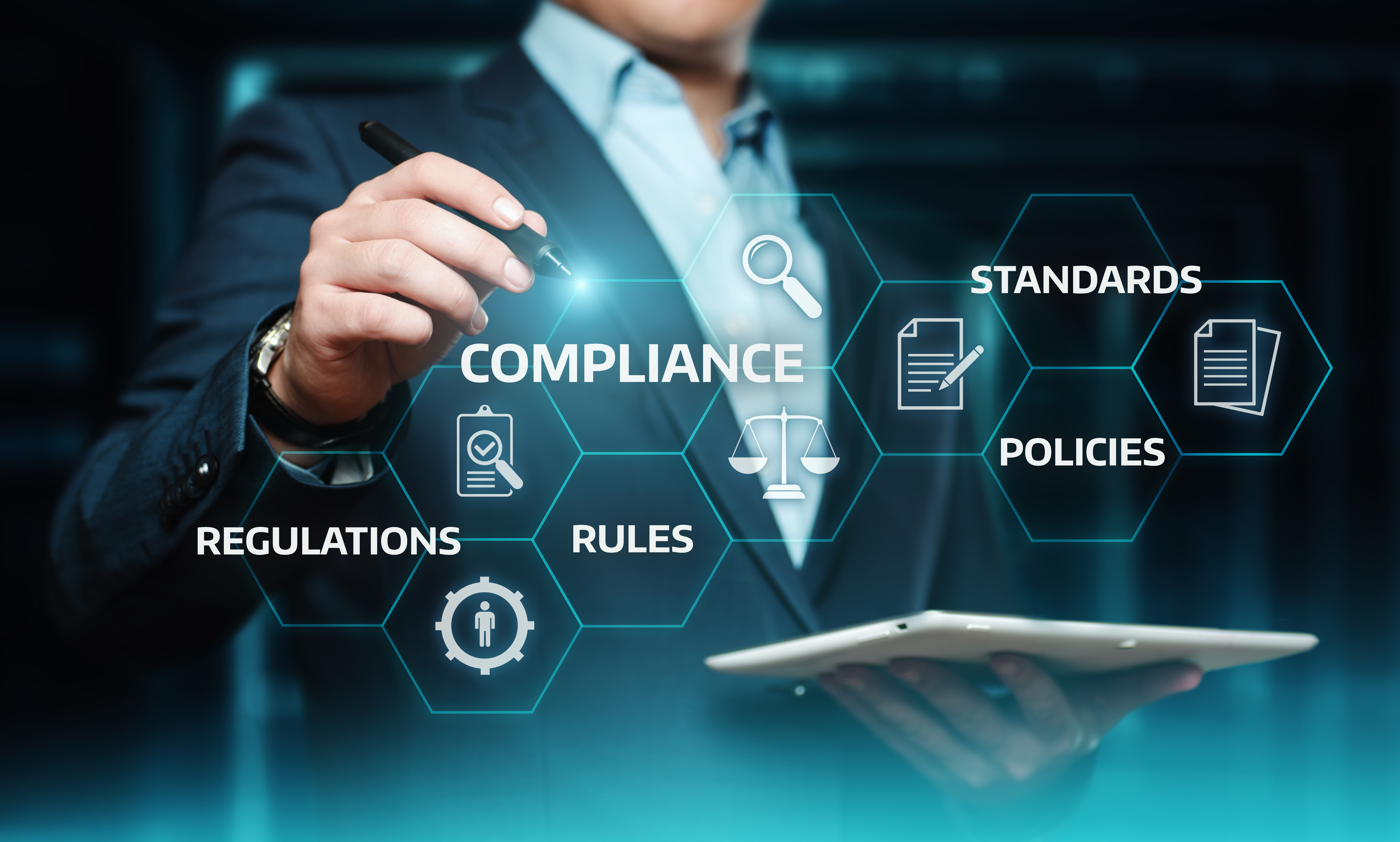 Business professional using a digital compliance dashboard